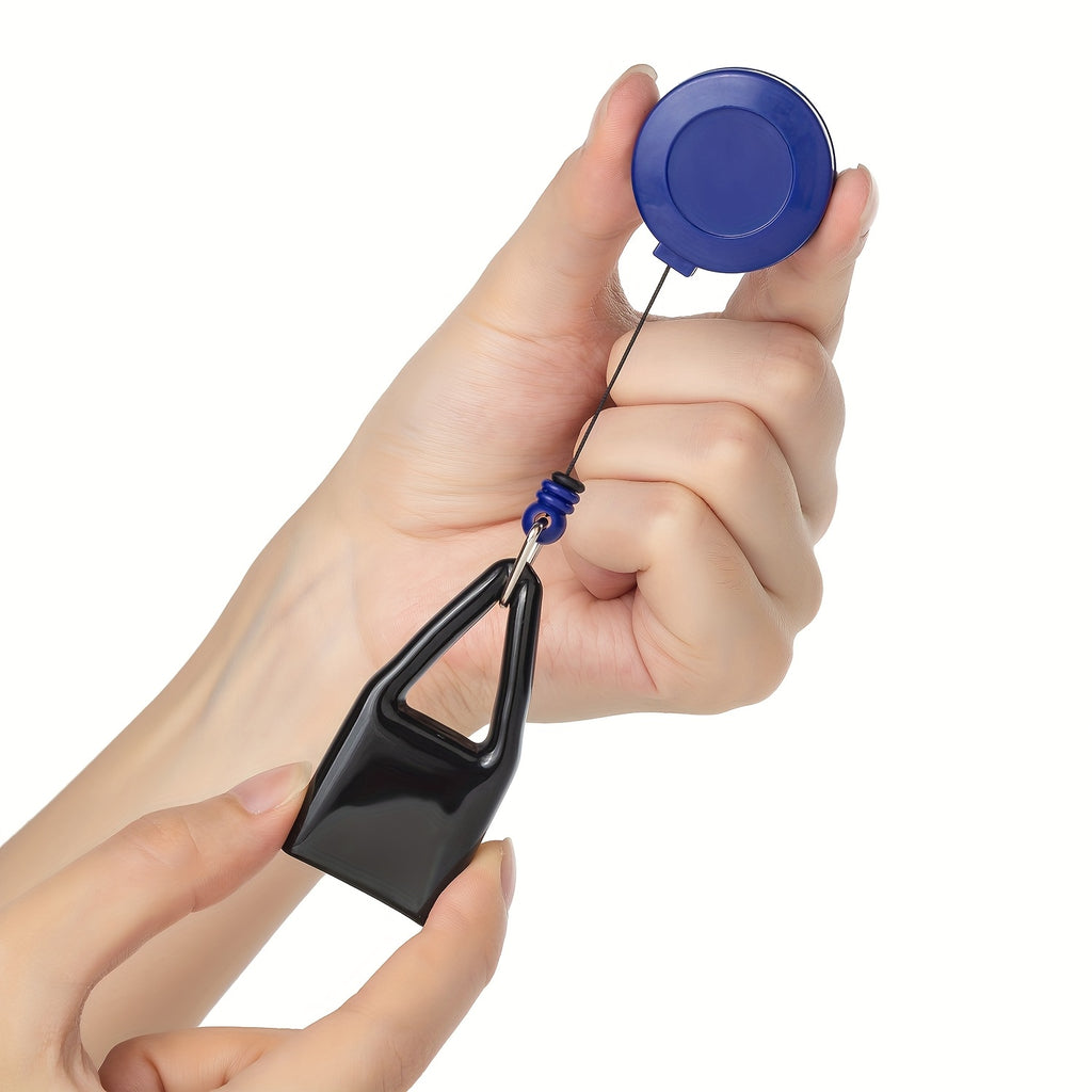 Blue light keychain clip shown in hand; black triangular pouch with quick-release ring
