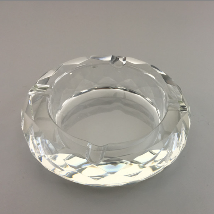 Round crystal ashtray, clear faceted glass with inner metal rim