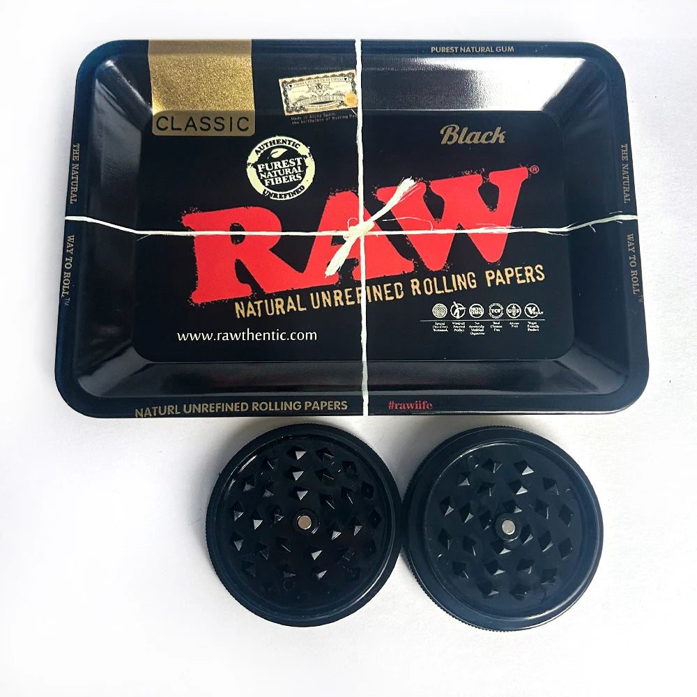 RAW ashtray and grinder set with black rolling tray and two dark grinder lids