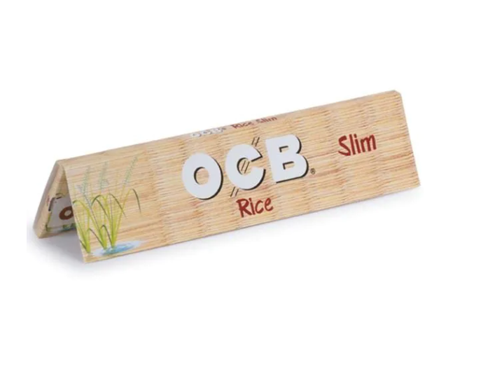 OCB rice rolling papers slim pack, tan cardboard with green leaf graphic