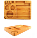 Small bamboo rolling tray with paw print logo, circular cutouts, and rectangular rolling area