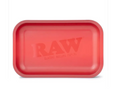 Matte red rolling tray with RAW logo on the recessed surface