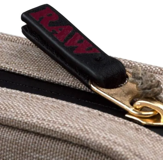 Beige fabric pouch with metal zipper and black zipper pull with red RAW lettering