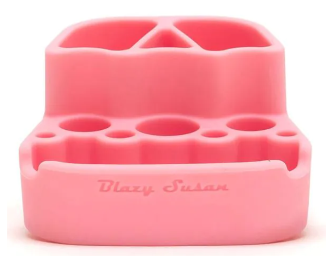 Pink spinning rolling tray with compartment cups and ridged storage slots