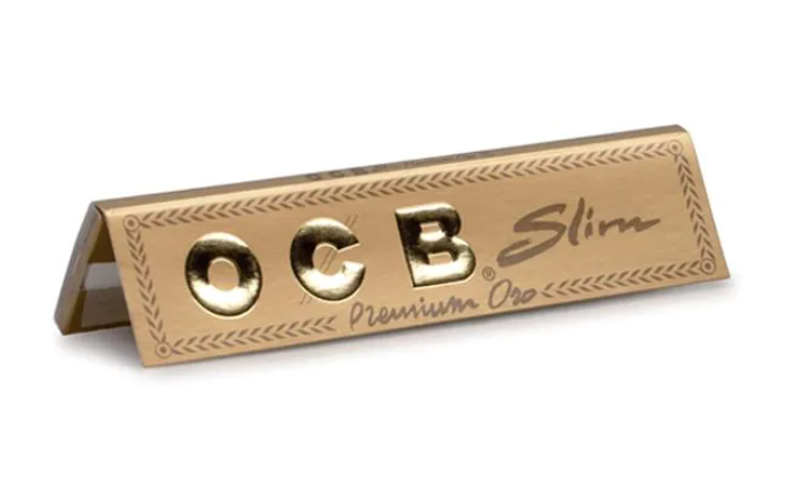 OCB slim premium rolling paper strip with gold and black logo text