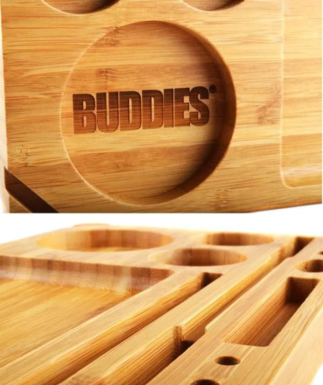 Bamboo rolling tray close-up with BUDDIES logo and small oval compartments