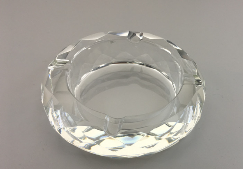 Round crystal ashtray, clear faceted glass and inner metal rim