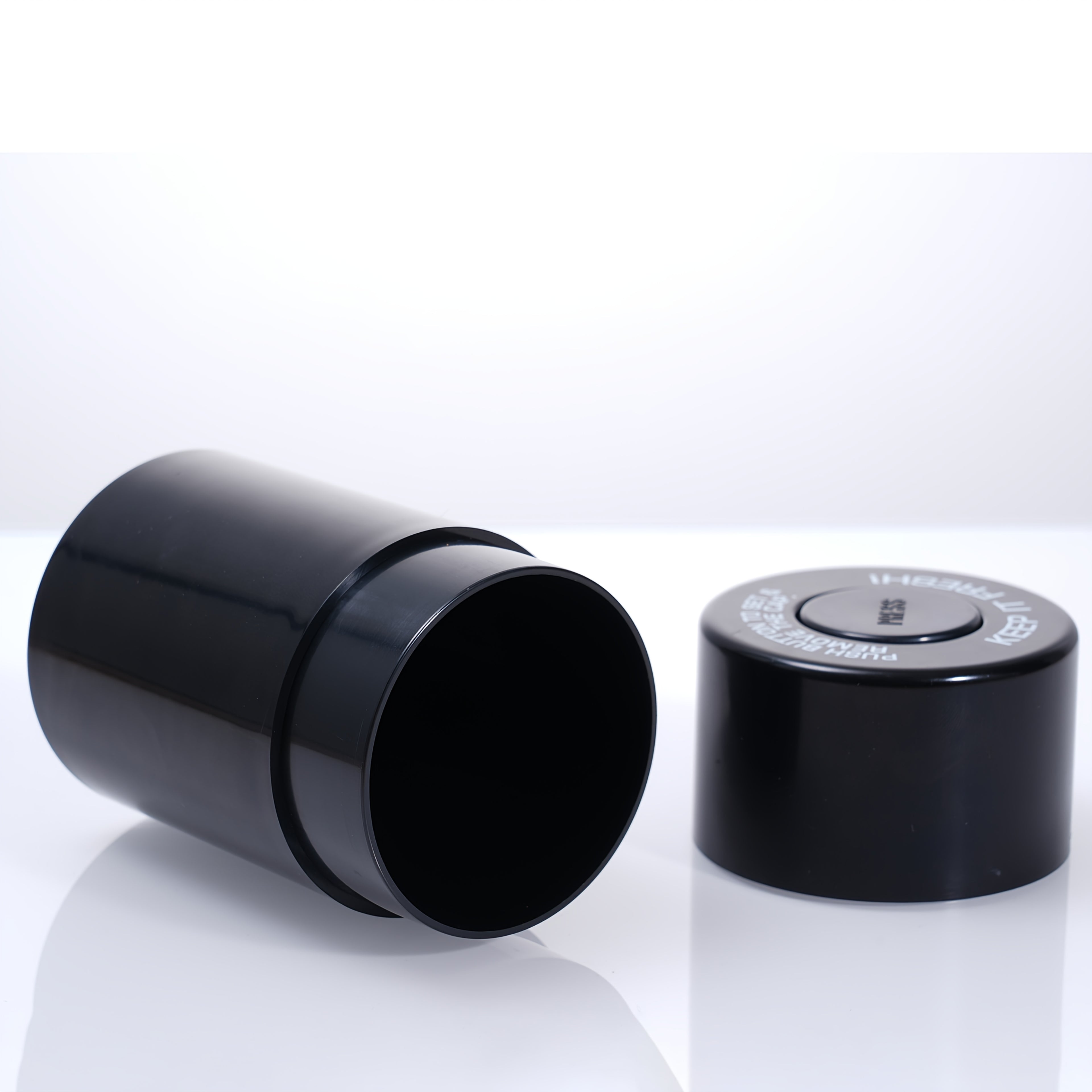 Black airtight storage jar with open base and matching snap lid