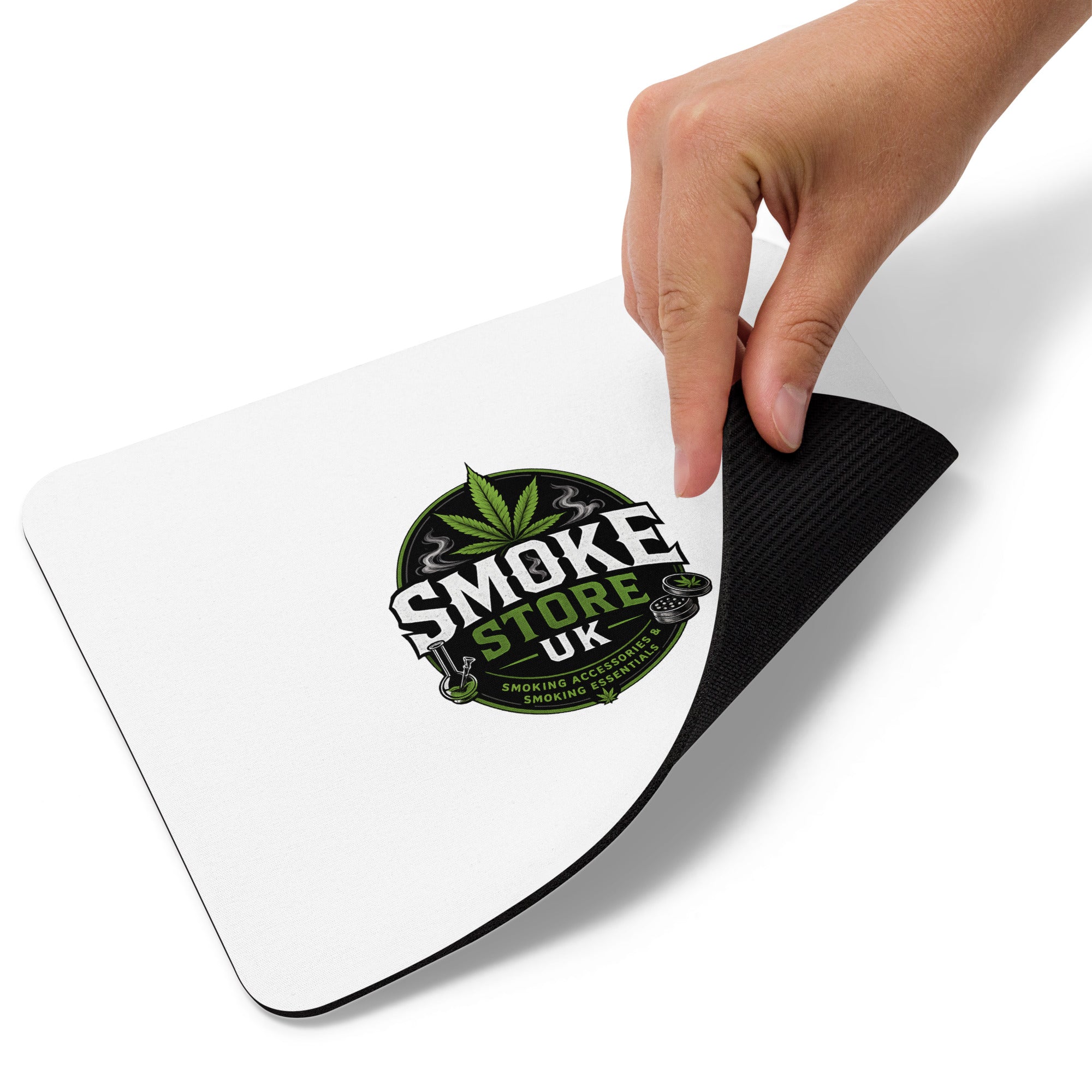 Mouse pad lifted to show black underside, with Smoke Store logo on the white top.