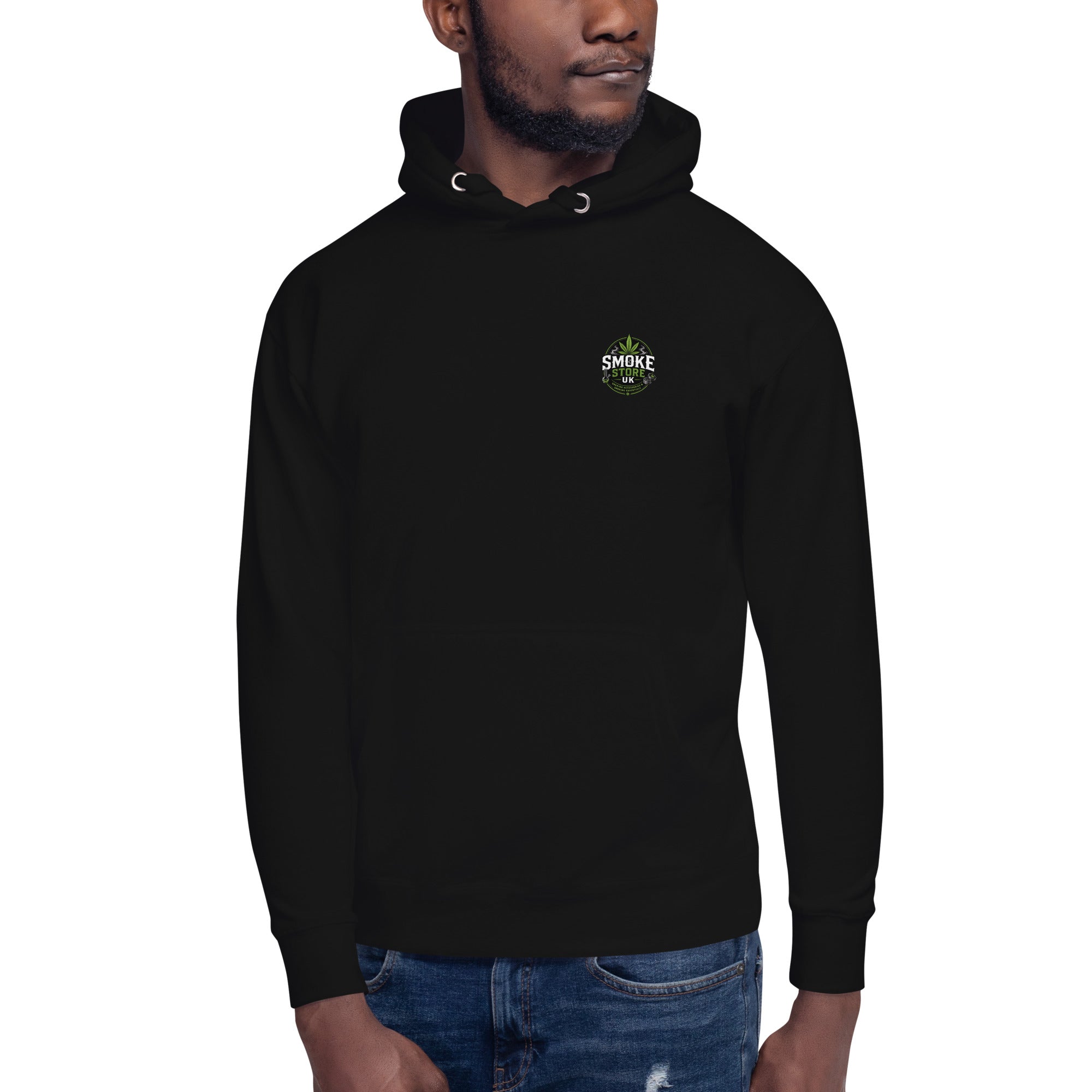 Black unisex hoodie with hood drawstring and small chest logo, worn with jeans.