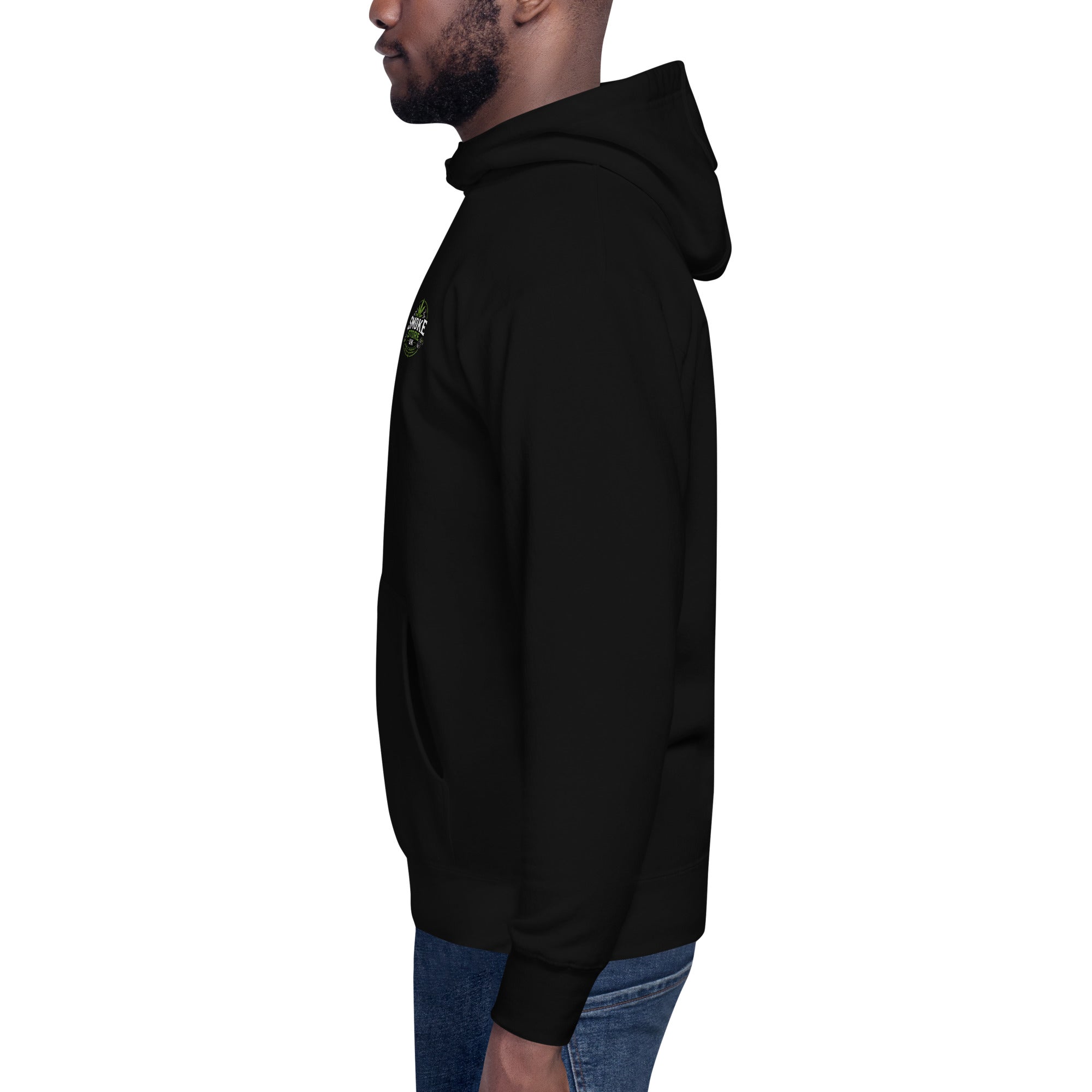 Black unisex hoodie side view with hood and small chest logo, worn with jeans.