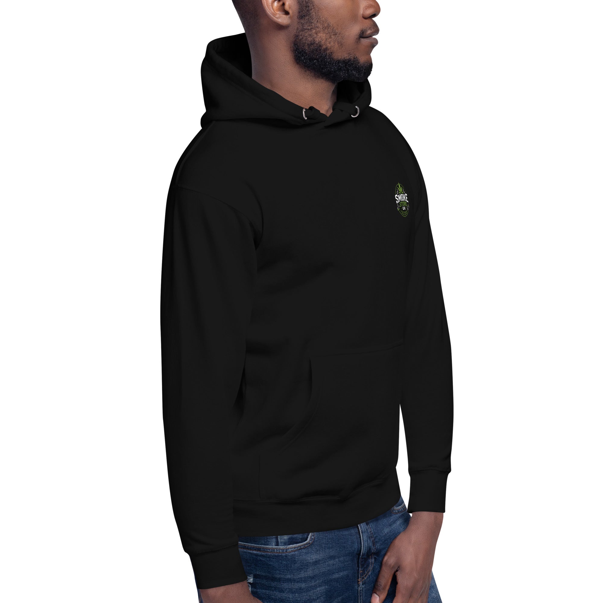 Black unisex hoodie with hood and small chest logo, worn with blue jeans.