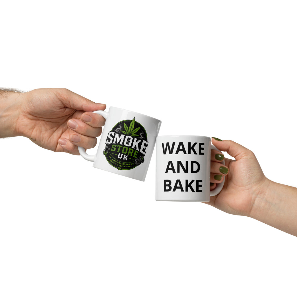 White glossy mug with Smoke Store UK logo and green leaf emblem