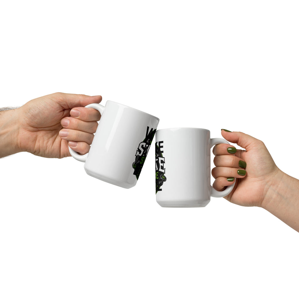 White glossy mug with printed “SMOKE STORE” and “WAKE AND BAKE,” held by two hands.