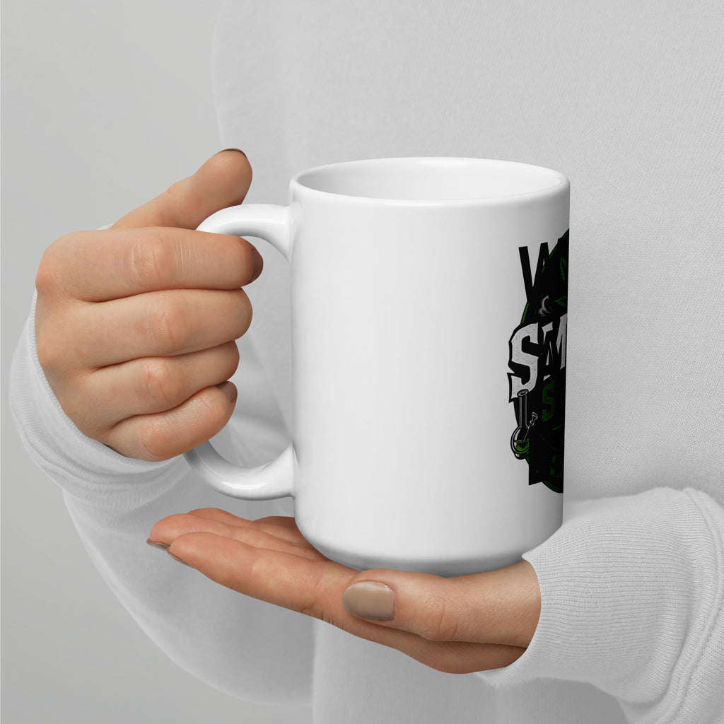 White glossy mug held in hands with partial Smoke Store UK logo