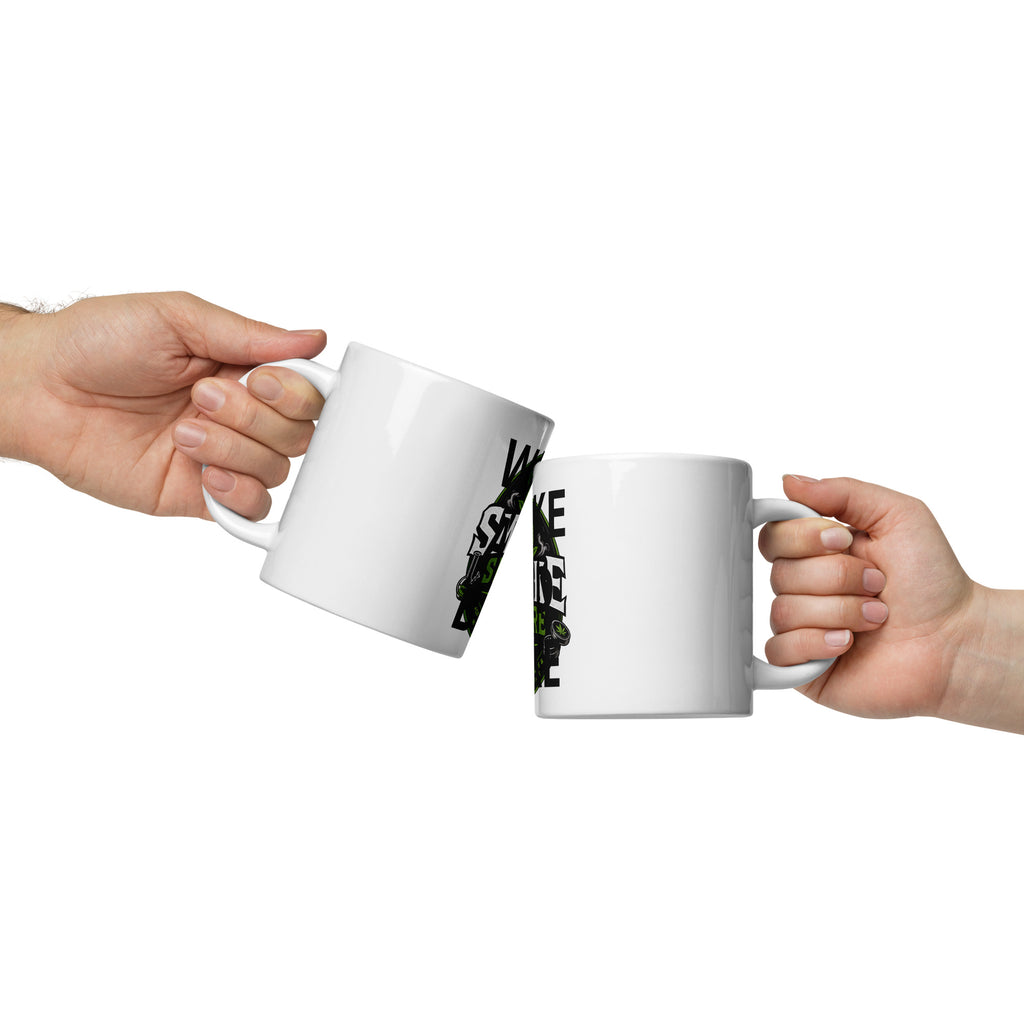 White glossy mugs with black graphic print, held in hands