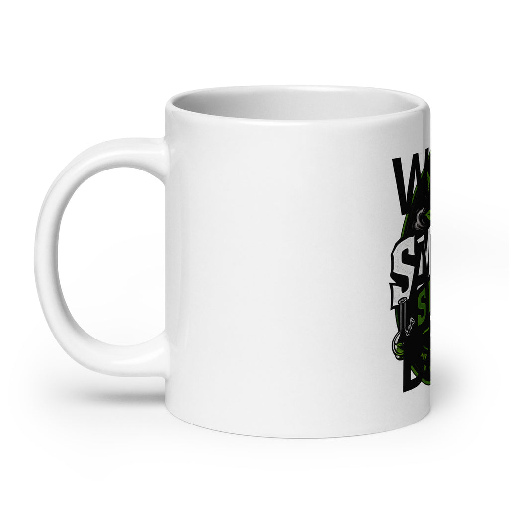 White glossy mug with side portion of green leaf and black “SMOKE” graphic.